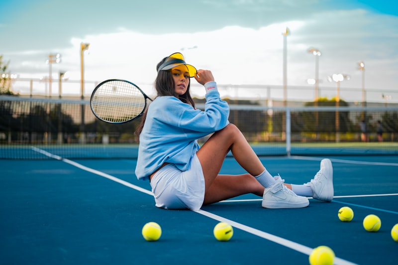 People playing tennis outdoors